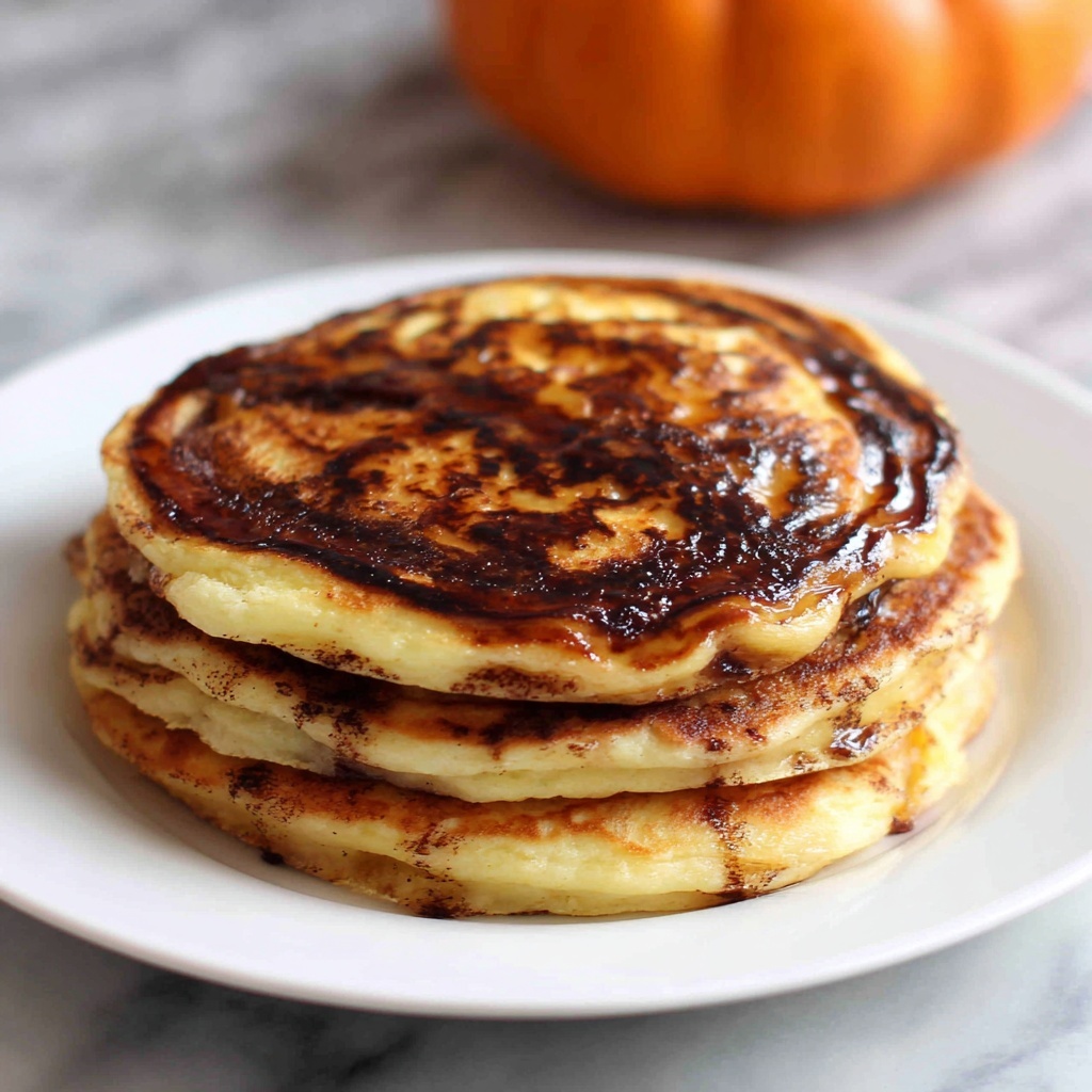 Pumpkin Cinnamon Roll Pancakes with Cream Cheese Glaze Recipe - Recipe Image